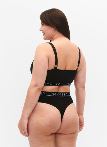 Sömlös stringtrosa  med normalhög midja, Black, Model image number 1