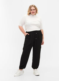 Enfärgade byxor med stora fickor, Black, Model