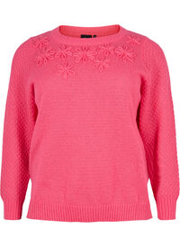 Stickad blus med blomsterdetaljer