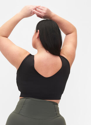 CORE, MID SUPPORT SPORTS BRA - Sport-bh med v-rygg, Black, Model image number 1