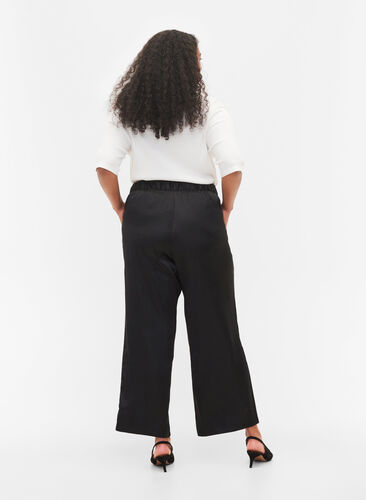 Byxor i lös passform med fickor och resårkant, Black, Model image number 1