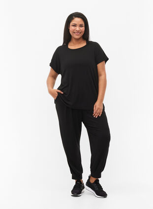 Kortärmad träningstopp med djup ringning i ryggen, Black, Model image number 2