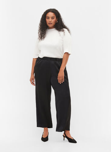 Byxor i lös passform med fickor och resårkant, Black, Model image number 0